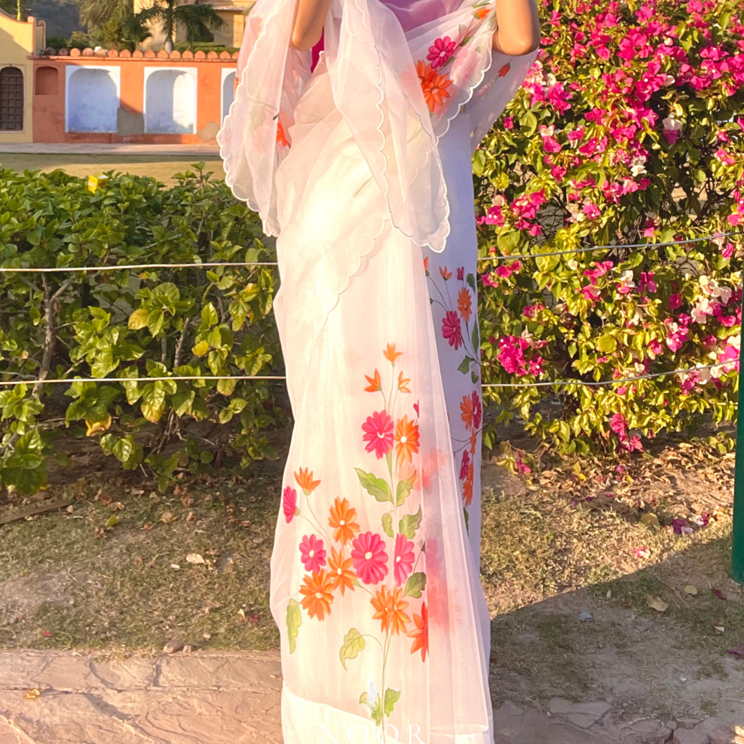 hand painted saree in pure organza silk by noor by hansa in white colour paired with a pure cotton blouse piece & scallop cutwork