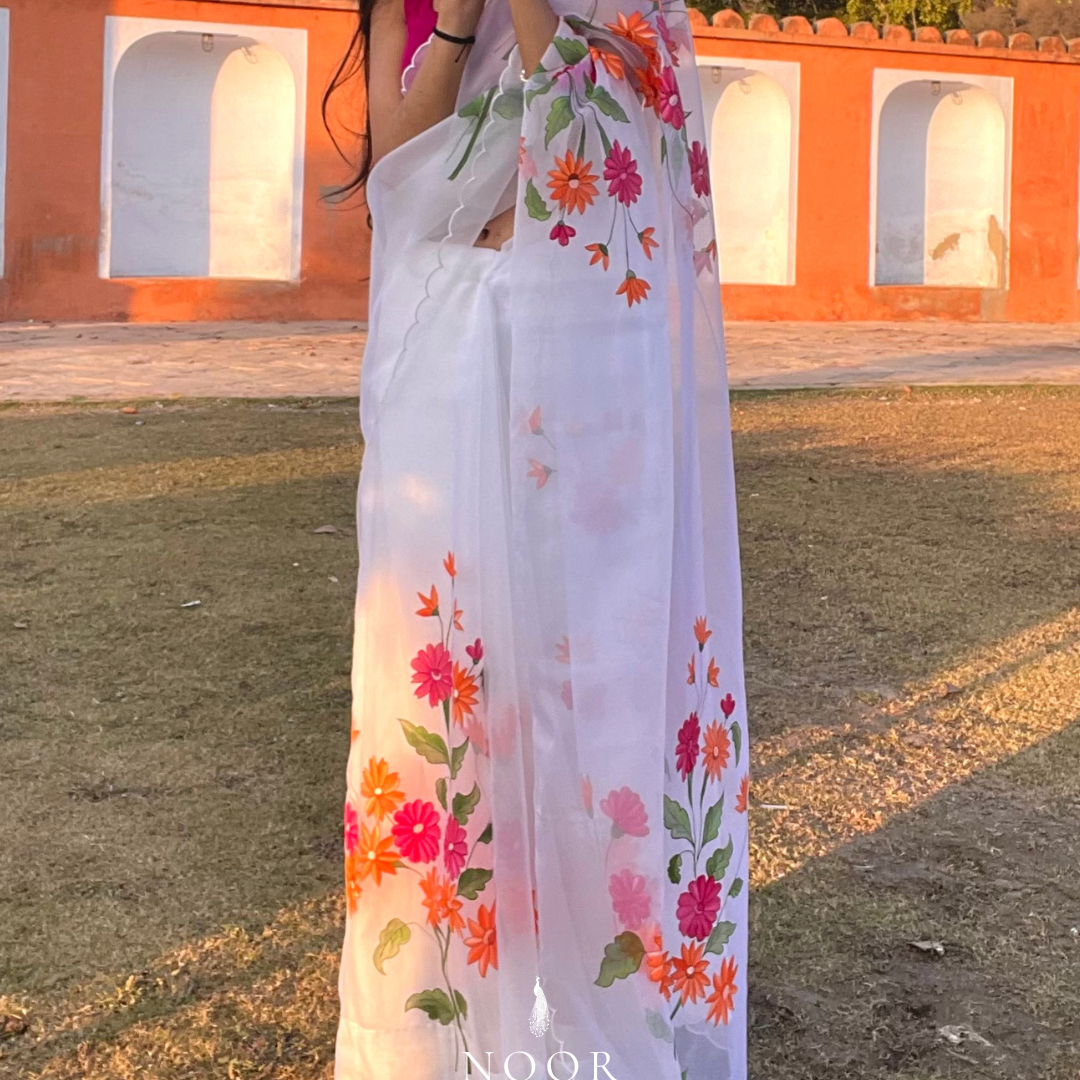 hand painted saree in pure organza silk by noor by hansa in white colour paired with a pure cotton blouse piece & scallop cutwork