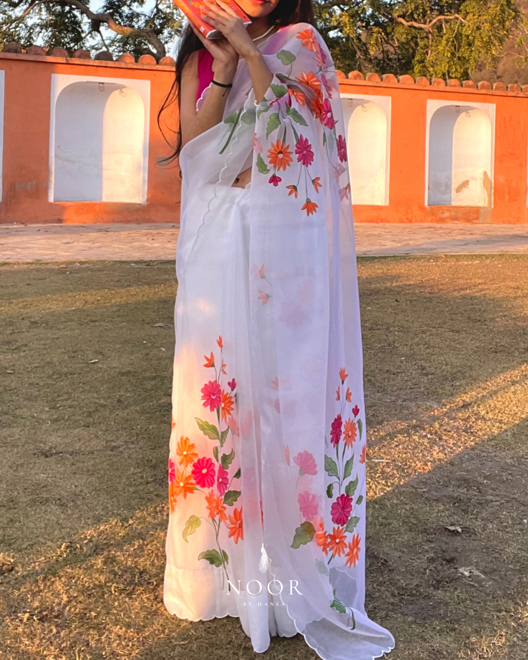 hand painted saree in pure organza silk by noor by hansa in white colour paired with a pure cotton blouse piece & scallop cutwork