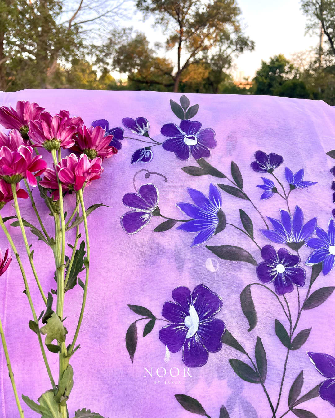 hand painted saree in pure organza silk by noor by hansa in lavender colour paired with a pure cotton blouse piece