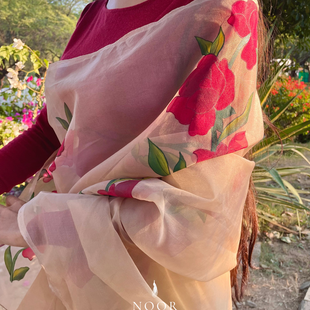 hand painted saree in pure organza silk by noor by hansa in beige colour paired with a pure cotton blouse piece