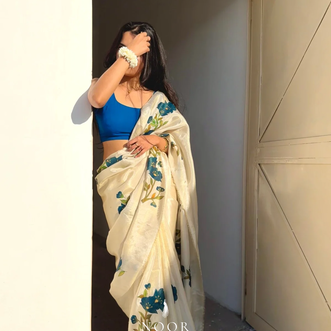 hand painted saree in tissue silk by noor by hansa paired with a blue blouse, hand painted sarees
handpainted sarees
handpainted sari
hand painted saris
jaipur sarees
handcrafted saris
organza silk sarees
tissue sarees
tissue saris
organza silk saris
noorbyhansa
noor by hansa