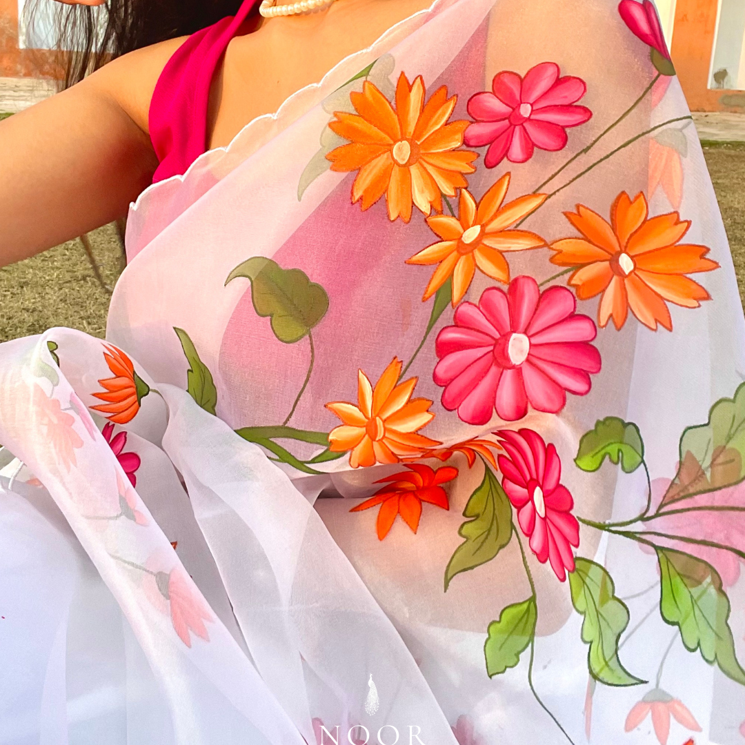 hand painted saree in pure organza silk by noor by hansa in white colour paired with a pure cotton blouse piece & scallop cutwork