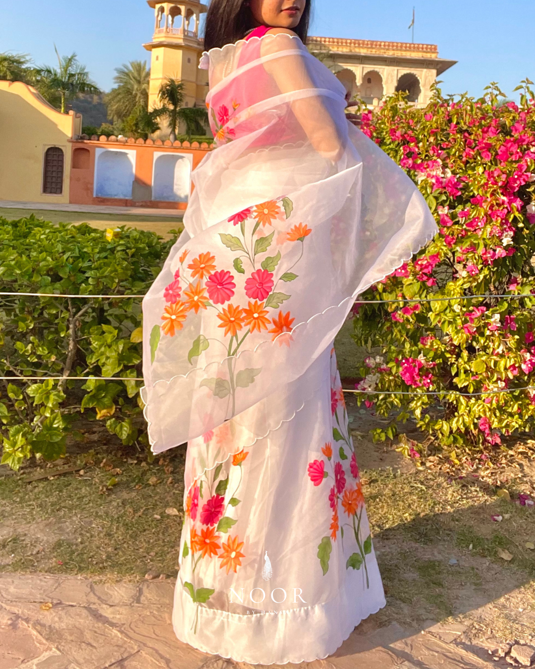 hand painted saree in pure organza silk by noor by hansa in white colour paired with a pure cotton blouse piece & scallop cutwork