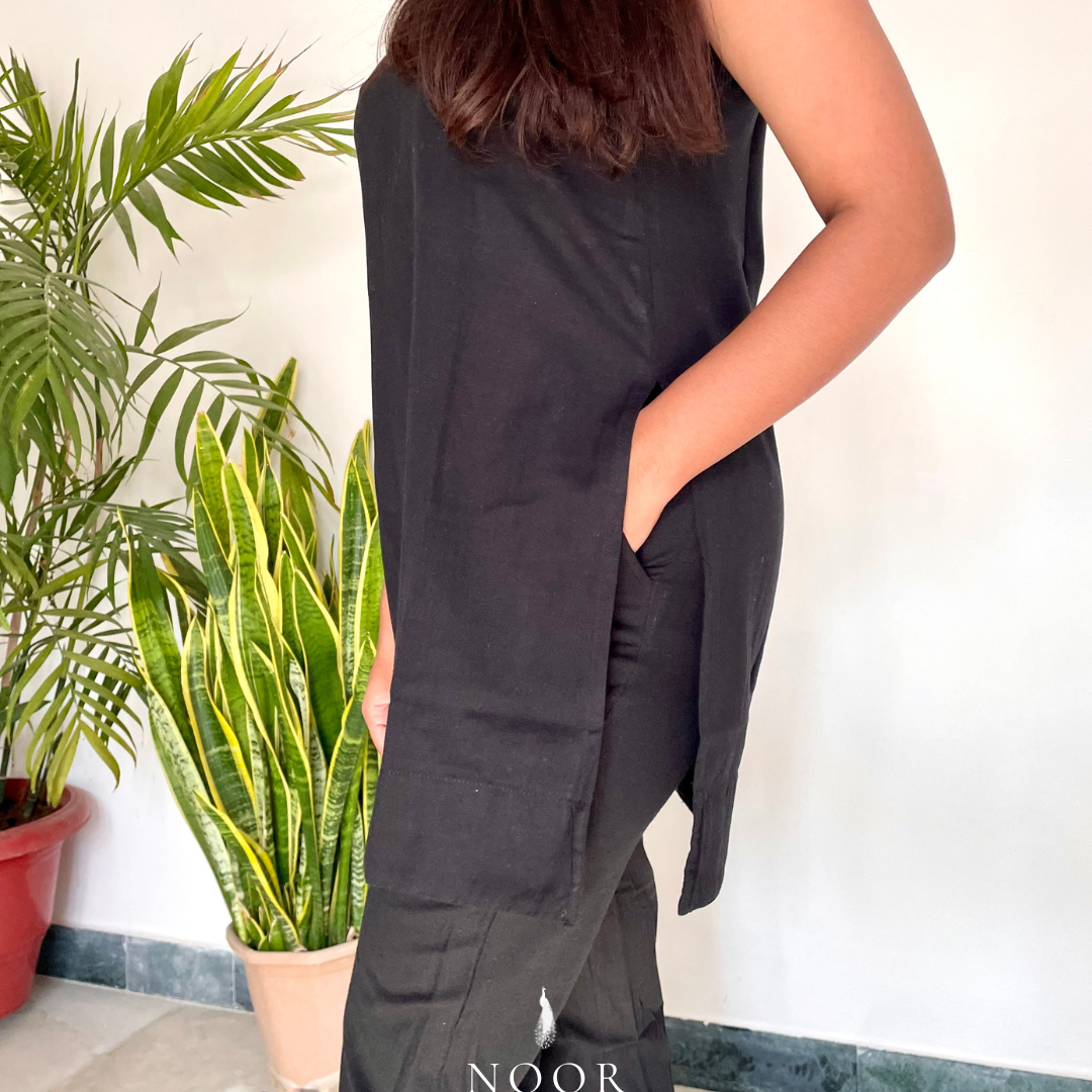 black cotton linen noor by hansa kurta co-ord set, crafted from a luxe linen-cotton blend that feels as good as it looks. available in five vibrant colours, this playful set is perfect for office wear or a day full of running errands