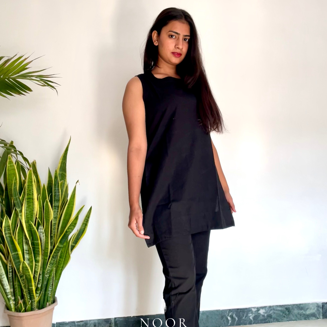 black cotton linen noor by hansa kurta co-ord set, crafted from a luxe linen-cotton blend that feels as good as it looks. available in five vibrant colours, this playful set is perfect for office wear or a day full of running errands