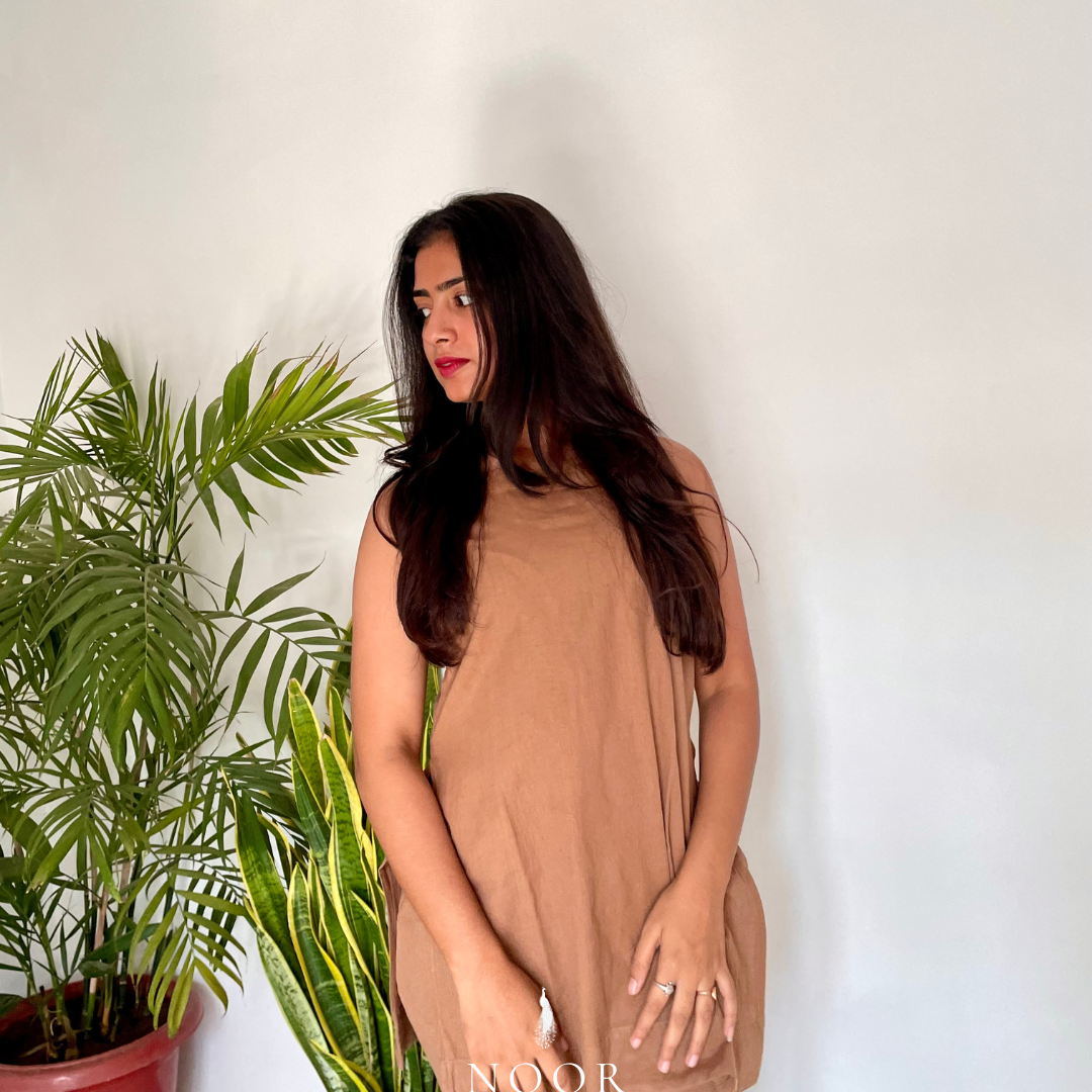 brown cotton linen noor by hansa kurta co-ord set, crafted from a luxe linen-cotton blend that feels as good as it looks. available in five vibrant colours, this playful set is perfect for office wear or a day full of running errands