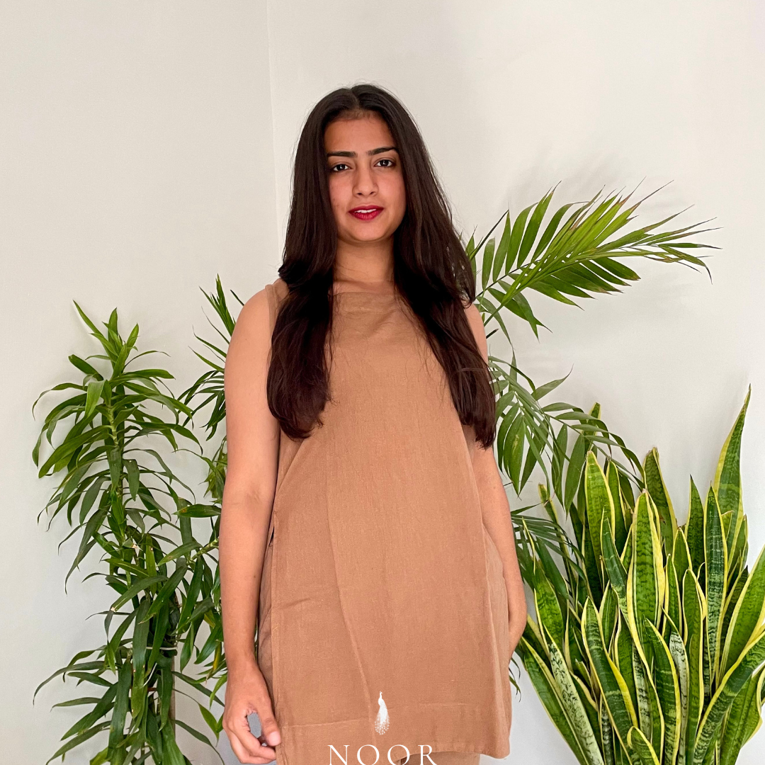 brown cotton linen noor by hansa kurta co-ord set, crafted from a luxe linen-cotton blend that feels as good as it looks. available in five vibrant colours, this playful set is perfect for office wear or a day full of running errands
