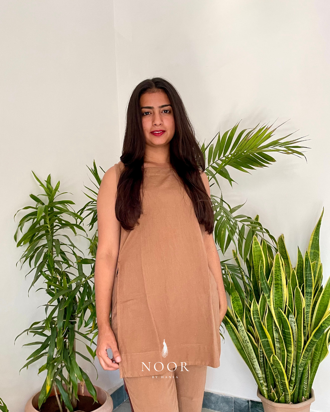 brown cotton linen noor by hansa kurta co-ord set, crafted from a luxe linen-cotton blend that feels as good as it looks. available in five vibrant colours, this playful set is perfect for office wear or a day full of running errands