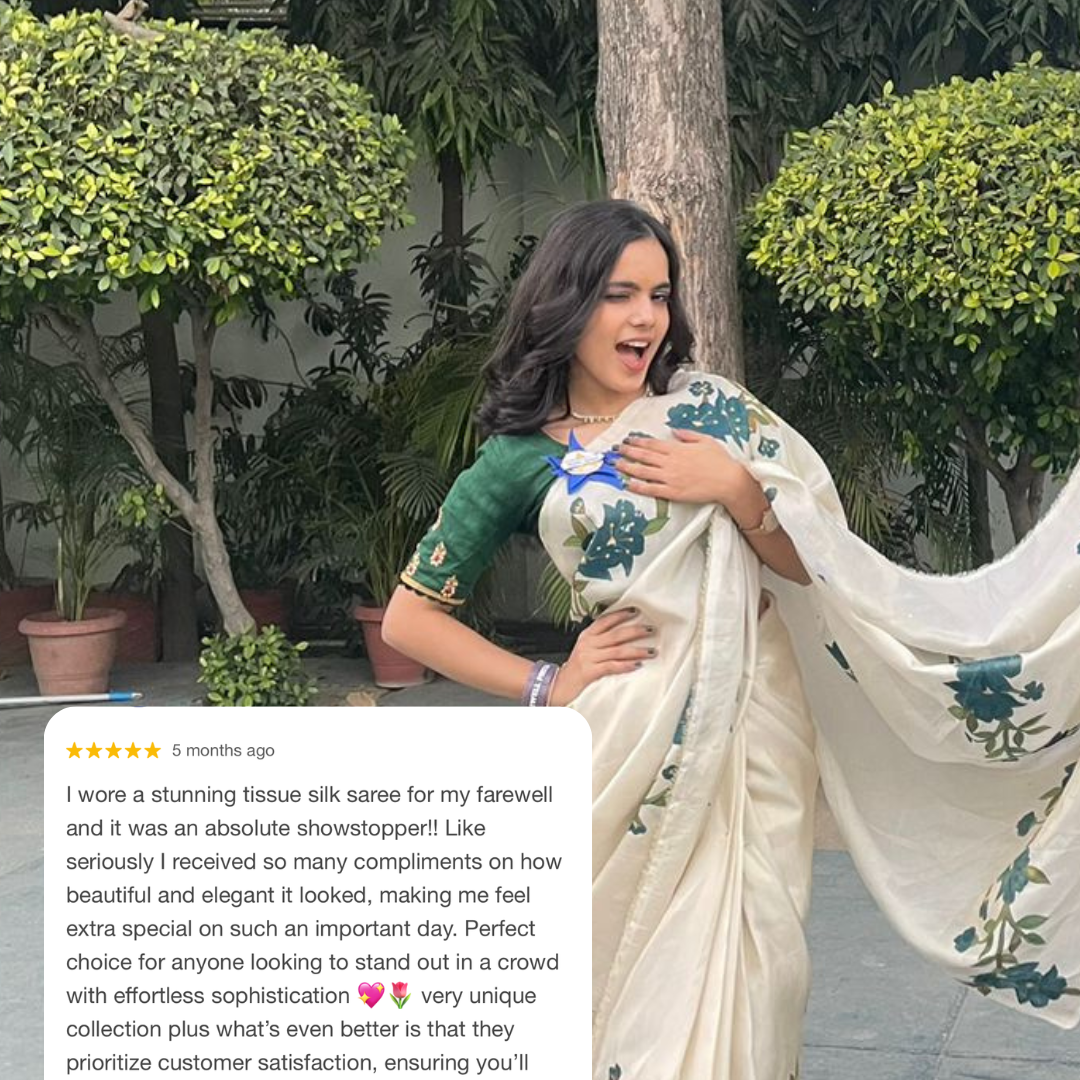 our hand-painted tissue silk 'nayaab' saree in soft tissue fabric with deep sea-blue flower motifs, detailed with gold tones & hand-done stone work. noor by hansa handmade hand painted saree in tissue fabric