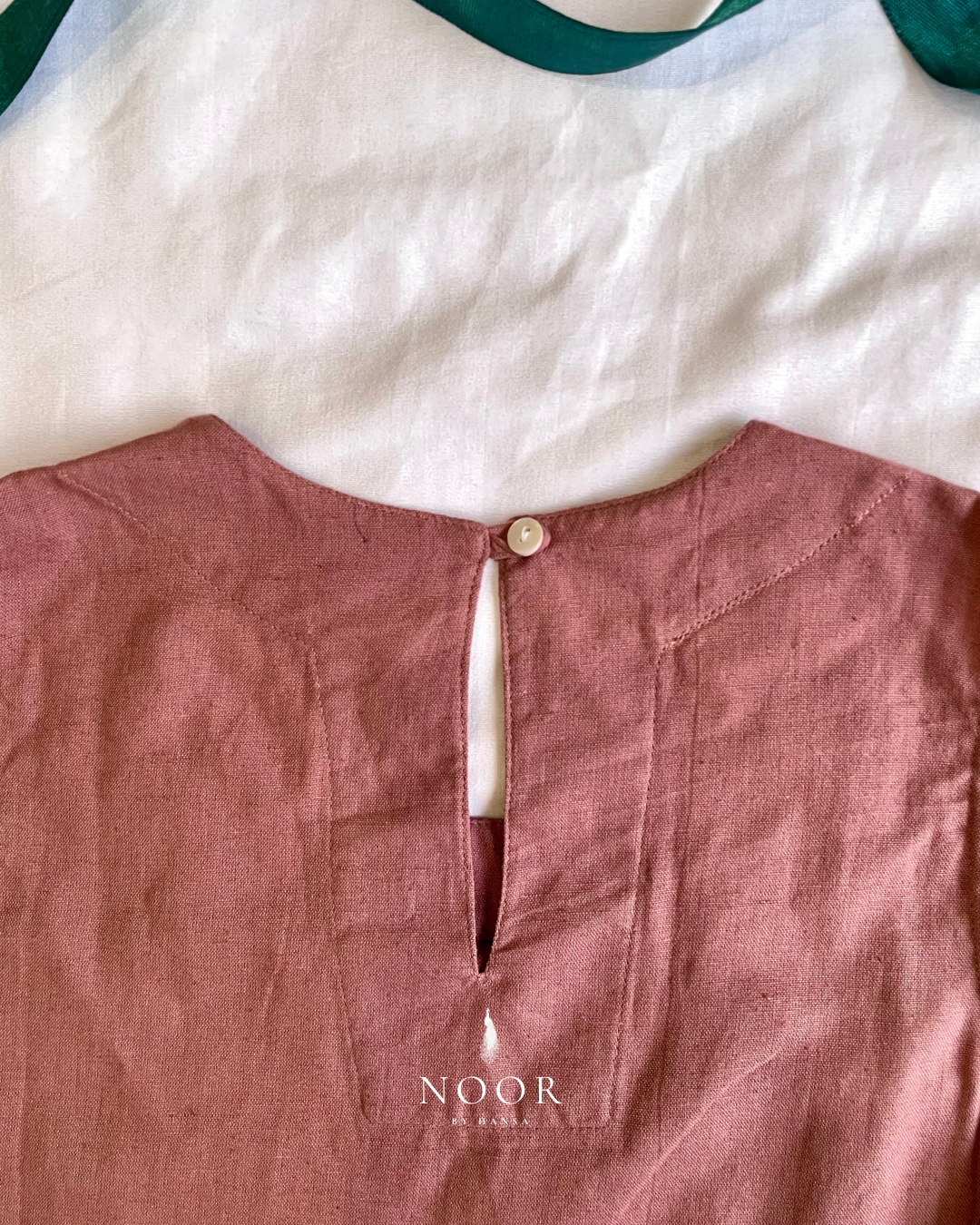 linen sleeveless kurtas brown ecru rose pink black white noor by hansa crafted from a luxe linen-cotton blend that feels as good as it looks. available in five vibrant colours, these would become your wardrobe staples
