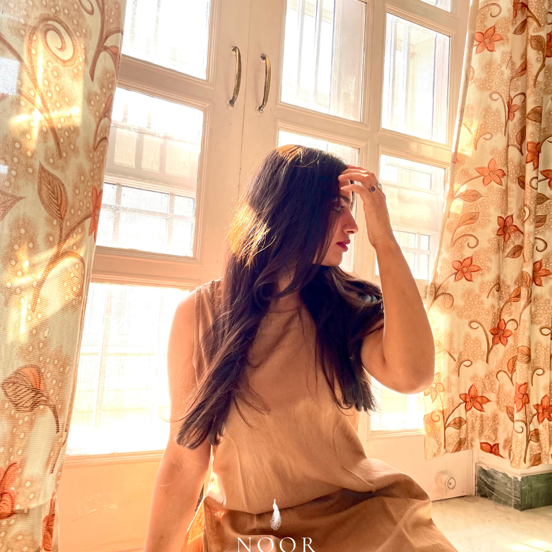 brown cotton linen noor by hansa kurta co-ord set, crafted from a luxe linen-cotton blend that feels as good as it looks. available in five vibrant colours, this playful set is perfect for office wear or a day full of running errands