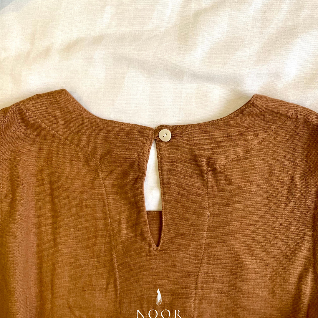 linen sleeveless kurtas brown ecru rose pink black white noor by hansa crafted from a luxe linen-cotton blend that feels as good as it looks. available in five vibrant colours, these would become your wardrobe staples