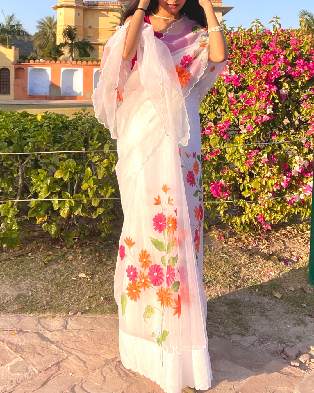 hand painted saree in pure organza silk by noor by hansa in white colour paired with a pure cotton blouse piece & scallop cutwork