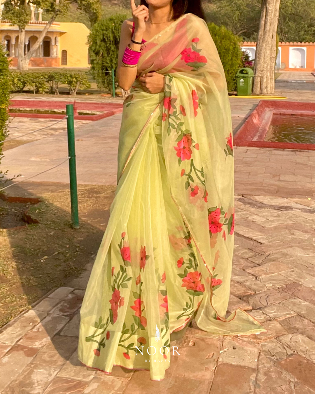 hand painted saree in pure organza silk by noor by hansa in pistachio green colour paired with a pure cotton blouse piece