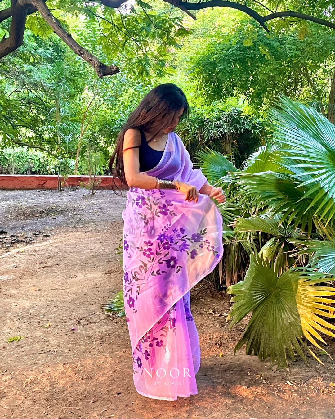 hand painted saree in pure organza silk by noor by hansa in lavender colour paired with a pure cotton blouse piece