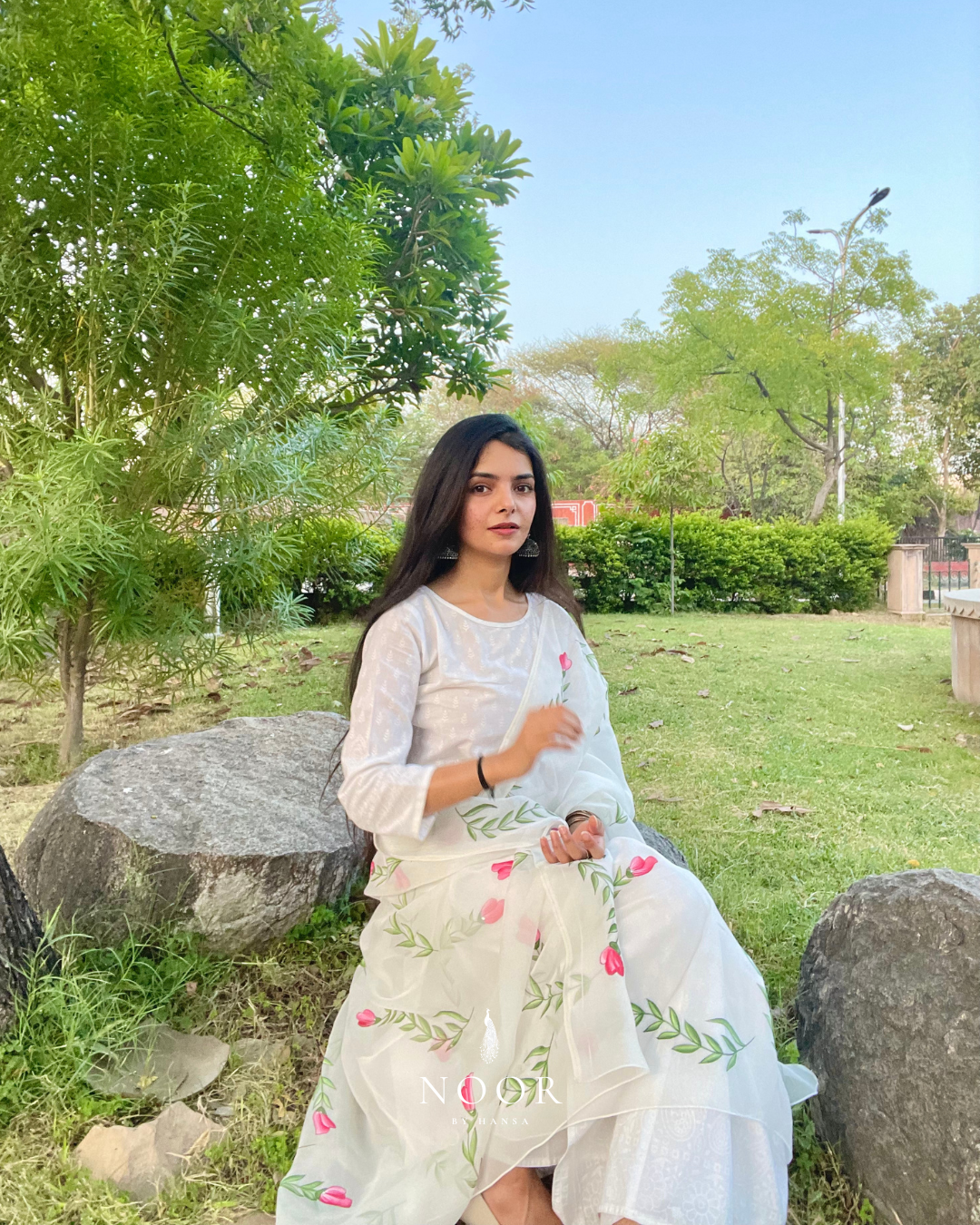 hand painted ivory 'jaituni' odhani in pure organza silk fabric with hand-painted motifs of leaves &amp; pink tulips spread all over, embellished with studded stones. light and flowy, this makes for a perfect summer essential