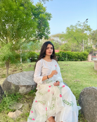 hand painted ivory 'jaituni' odhani in pure organza silk fabric with hand-painted motifs of leaves &amp; pink tulips spread all over, embellished with studded stones. light and flowy, this makes for a perfect summer essential