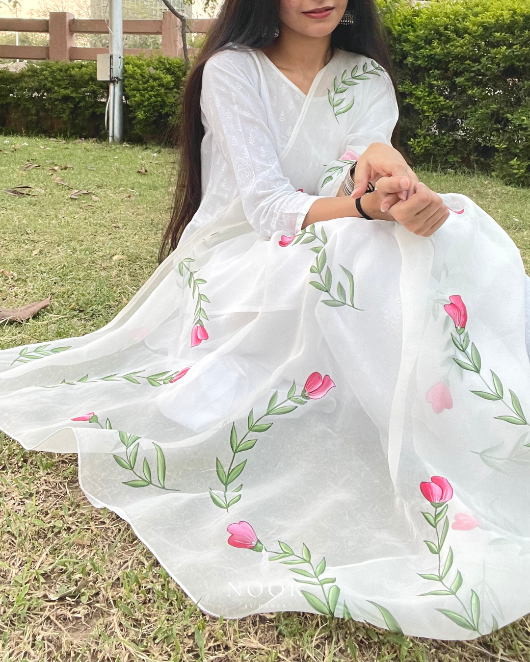 hand painted ivory 'jaituni' odhani in pure organza silk fabric with hand-painted motifs of leaves &amp; pink tulips spread all over, embellished with studded stones. light and flowy, this makes for a perfect summer essential