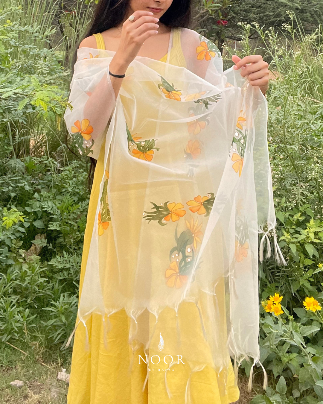 our hand painted ivory 'fanaa' odhani in pure organza silk with whimsical yellow motifs, studded with minimal gold stones and edged with fringes