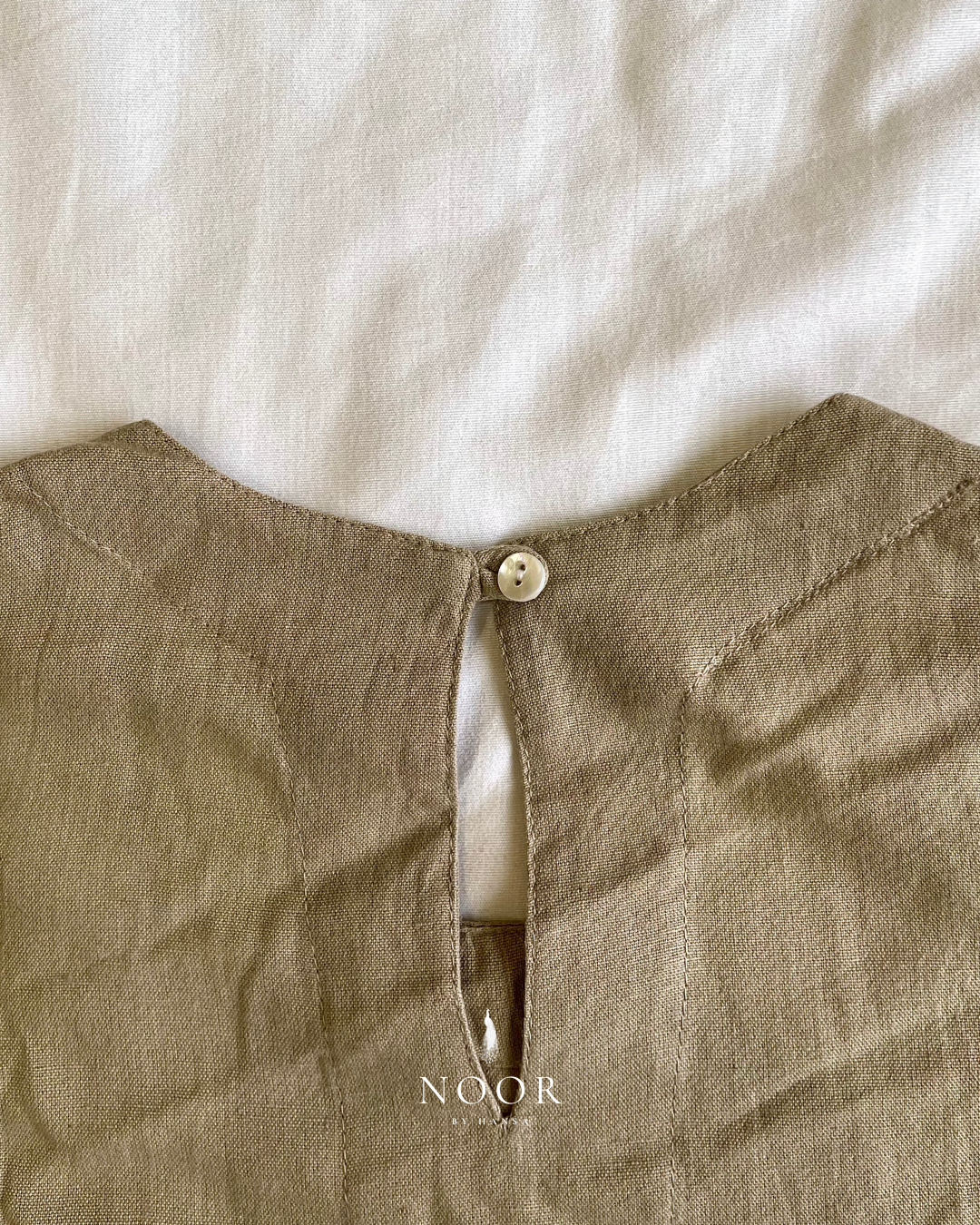 linen sleeveless kurtas brown ecru rose pink black white noor by hansa crafted from a luxe linen-cotton blend that feels as good as it looks. available in five vibrant colours, these would become your wardrobe staples