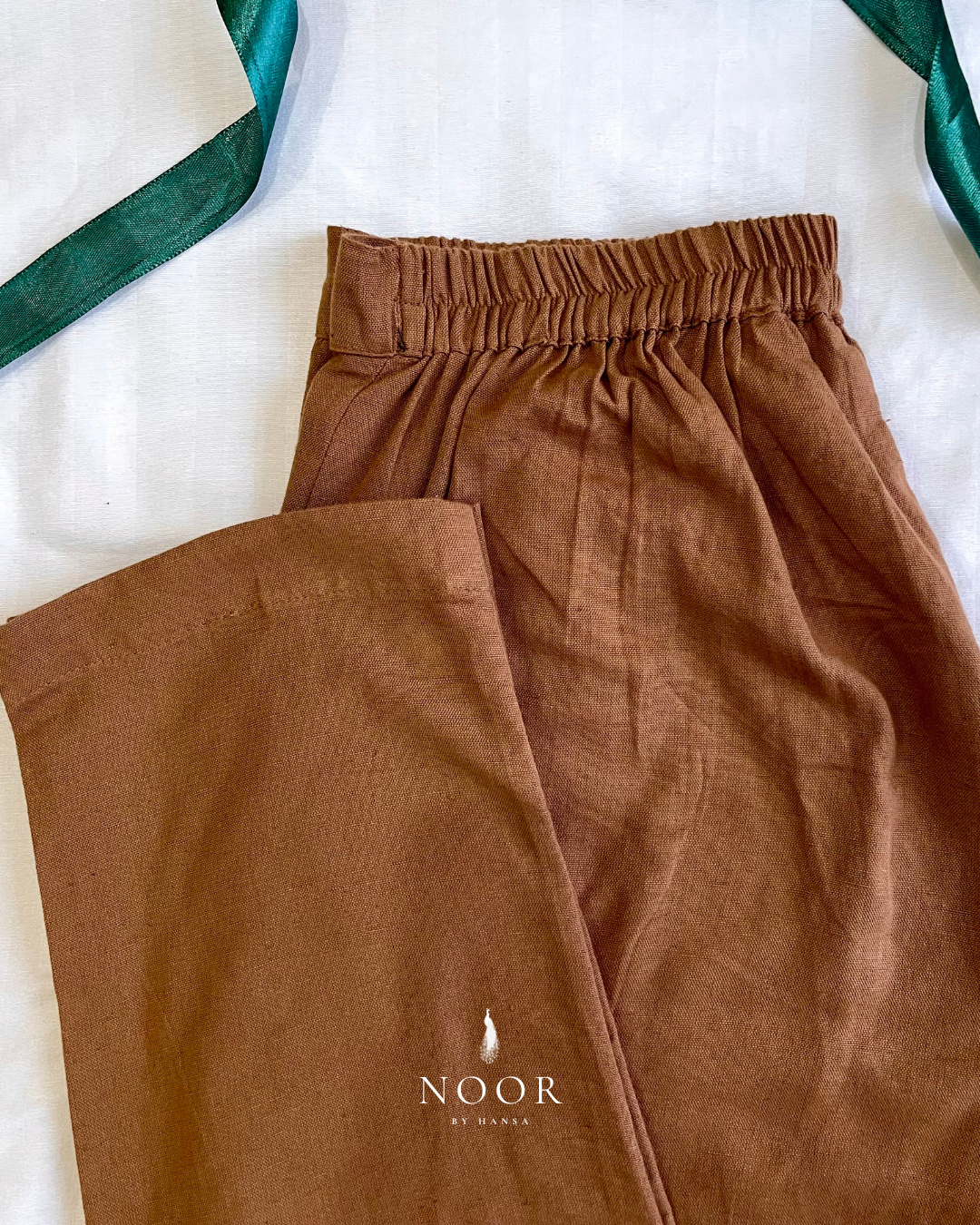 linen straight fit pants noor by hansa rose pink black brown grey ecru white crafted from a luxe linen-cotton blend that feels as good as it looks. available in five vibrant colours, they're really made for the indian body type - no more fitting into what was not made for us!

style tip pair these pants with linen shirts, cotton kurtas or basic tank tops for a chic look on a busy day!