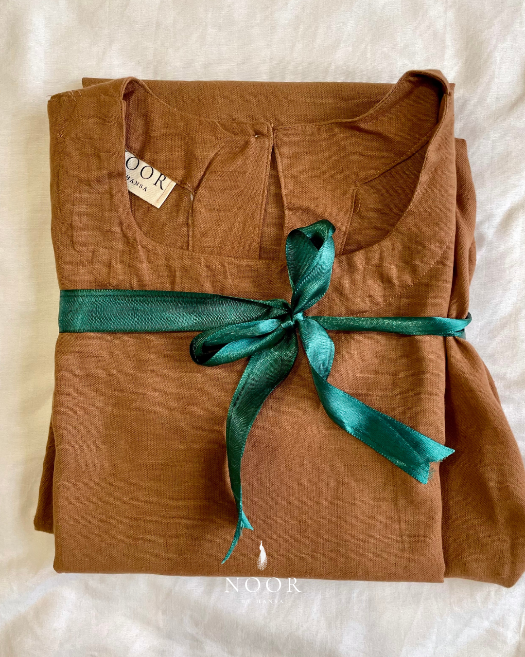 linen sleeveless kurtas brown ecru rose pink black white noor by hansa crafted from a luxe linen-cotton blend that feels as good as it looks. available in five vibrant colours, these would become your wardrobe staples