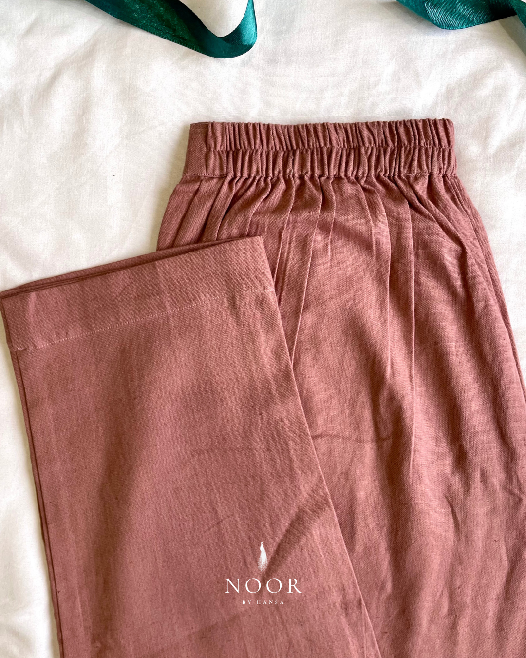 linen straight fit pants noor by hansa rose pink black brown grey ecru white crafted from a luxe linen-cotton blend that feels as good as it looks. available in five vibrant colours, they're really made for the indian body type - no more fitting into what was not made for us!

style tip pair these pants with linen shirts, cotton kurtas or basic tank tops for a chic look on a busy day!