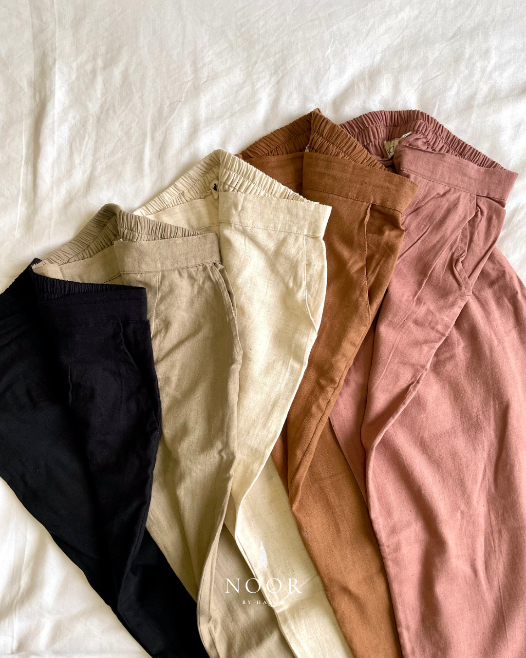 linen straight fit pants noor by hansa rose pink black brown grey ecru white crafted from a luxe linen-cotton blend that feels as good as it looks. available in five vibrant colours, they're really made for the indian body type - no more fitting into what was not made for us!

style tip: pair these pants with linen shirts, cotton kurtas or basic tank tops for a chic look on a busy day!