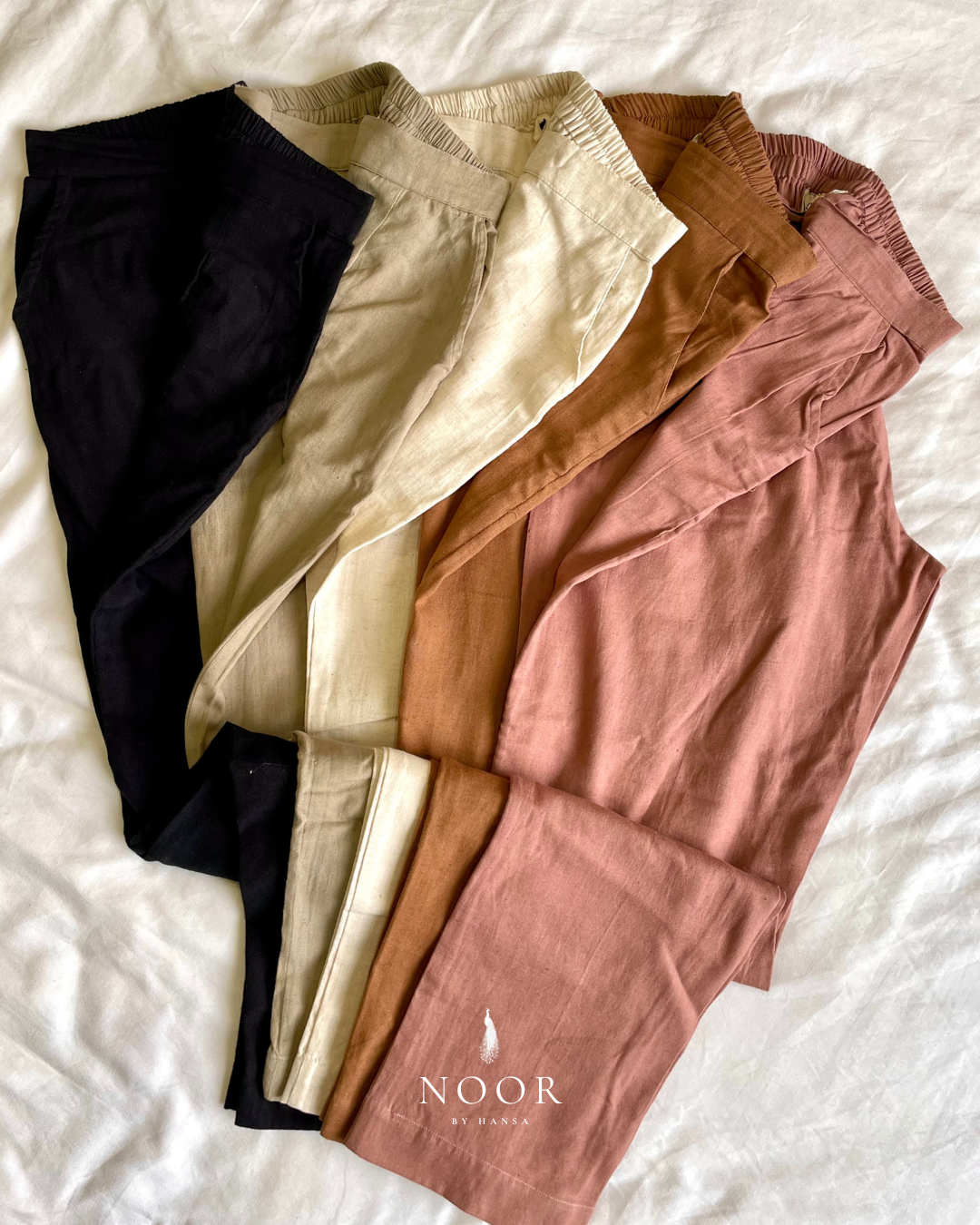linen straight fit pants noor by hansa rose pink black brown grey ecru white crafted from a luxe linen-cotton blend that feels as good as it looks. available in five vibrant colours, they're really made for the indian body type - no more fitting into what was not made for us!

style tip pair these pants with linen shirts, cotton kurtas or basic tank tops for a chic look on a busy day!